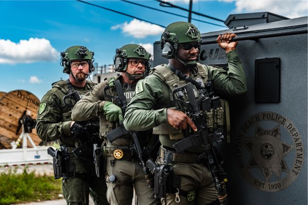 SWAT riding on the back of the truck